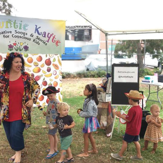 Auntie Kayte performing children's music at Littlepalooza